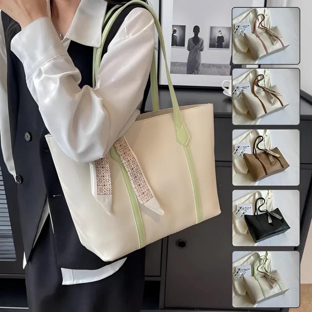 Large soft tote shoulder bag in khaki colour with a crossbody strap and visible sewing line detail.