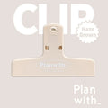 Blue Haze Series magnetic ledger clip holding papers, showing size and magnetic closure