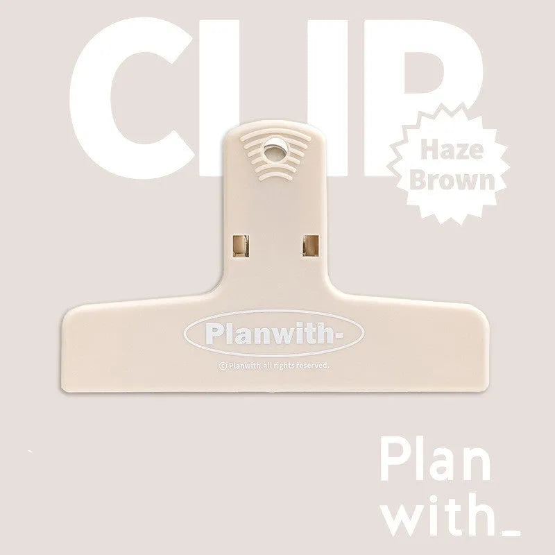 Blue Haze Series magnetic ledger clip holding papers, showing size and magnetic closure