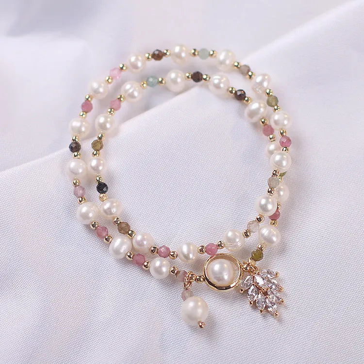 Women's double layer crystal bracelet with lucky cat charm and red cat's eye flowers design.