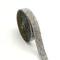 A 1 yard long strip of self-adhesive glass water drills in white and AB colour for clothing decoration