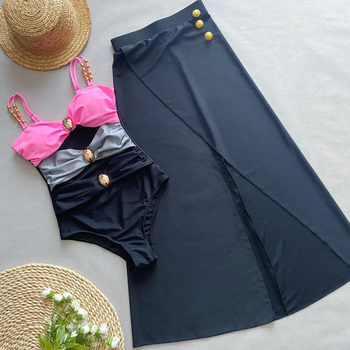 Women's brown one-piece swimsuit with matching beige skirt swimwear set on a neutral background.