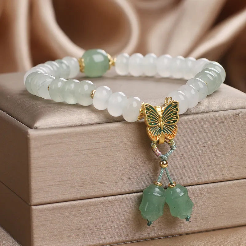 Green Tian Shan Cui abacus bead bracelet with retro butterfly tassel and pearl accents