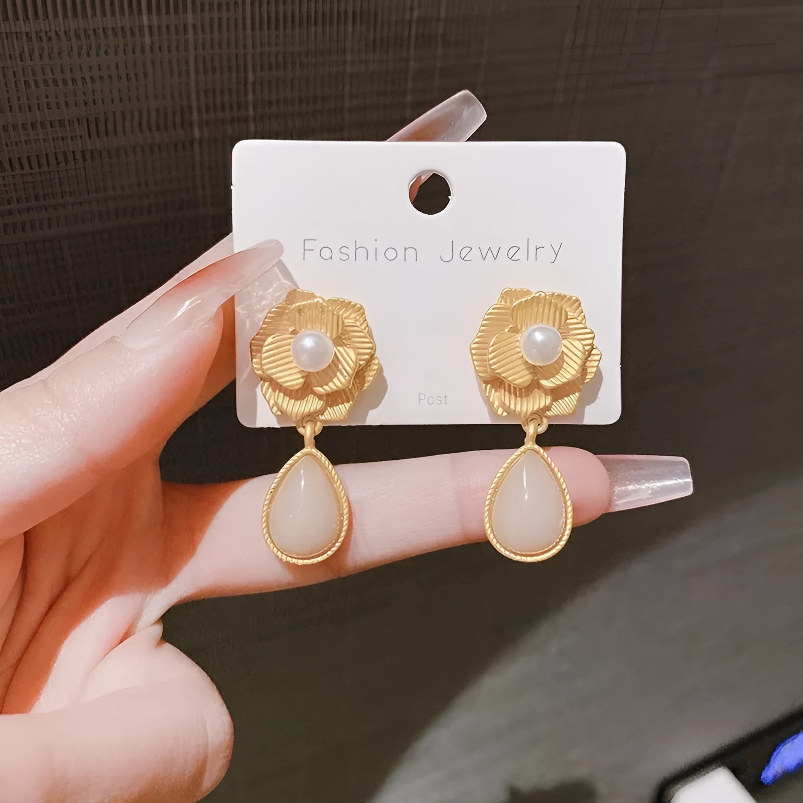 Gold colour stud earrings with ice flower pattern, rose pearl design, and central opal stone