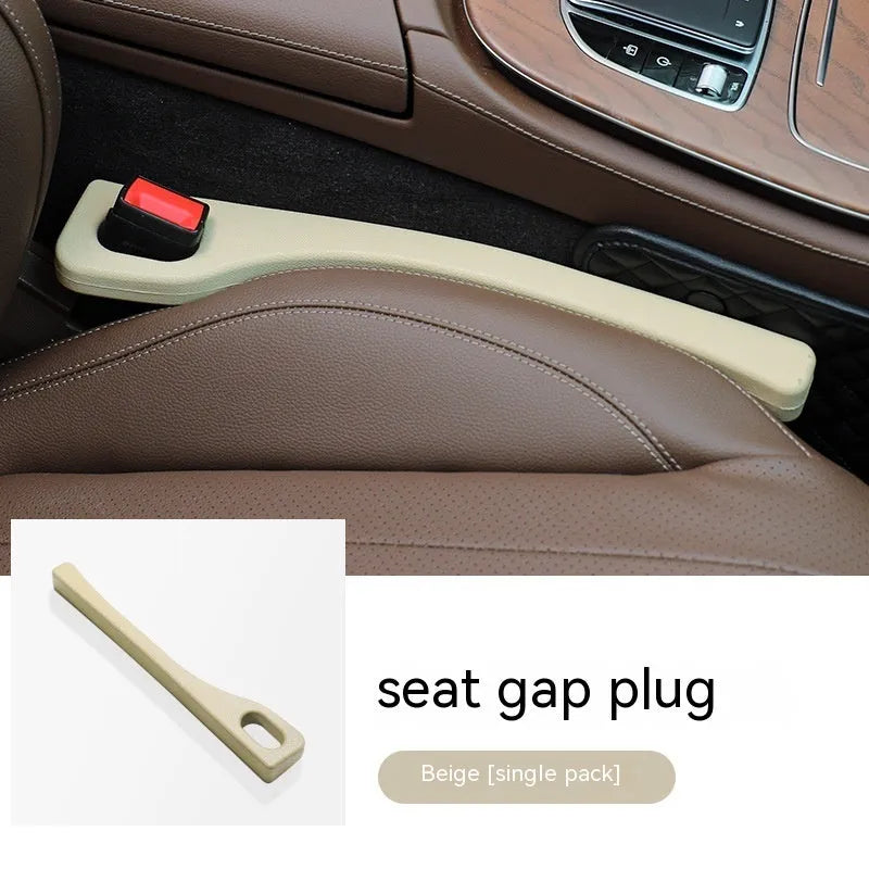 A pair of polyurethane car seat gap strips in beige colour on a car seat.