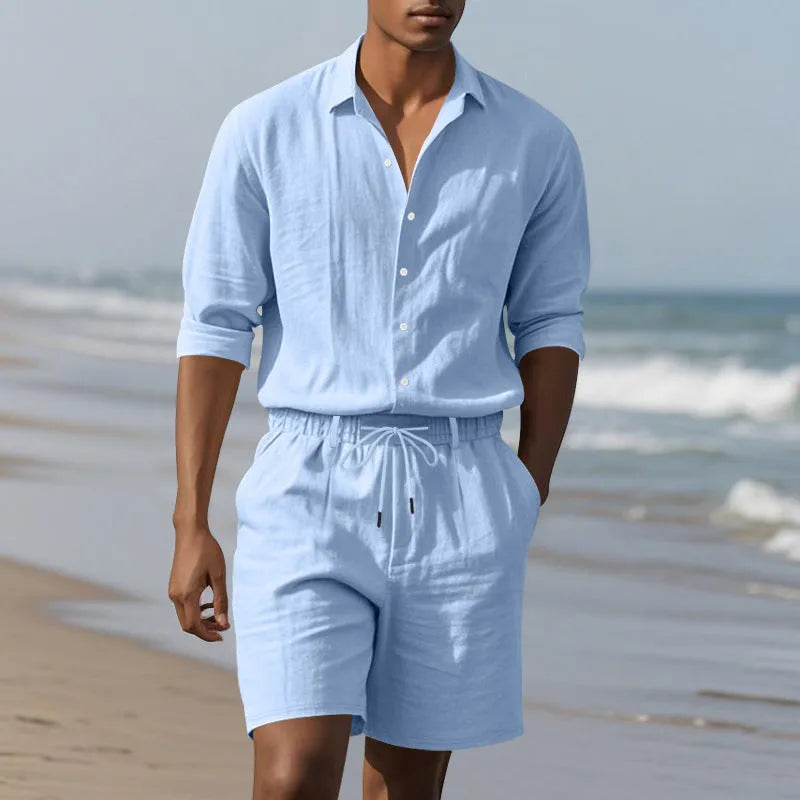 Men's linen long sleeve shirt and shorts beach suit set on a hanger, shown in a light blue colour.