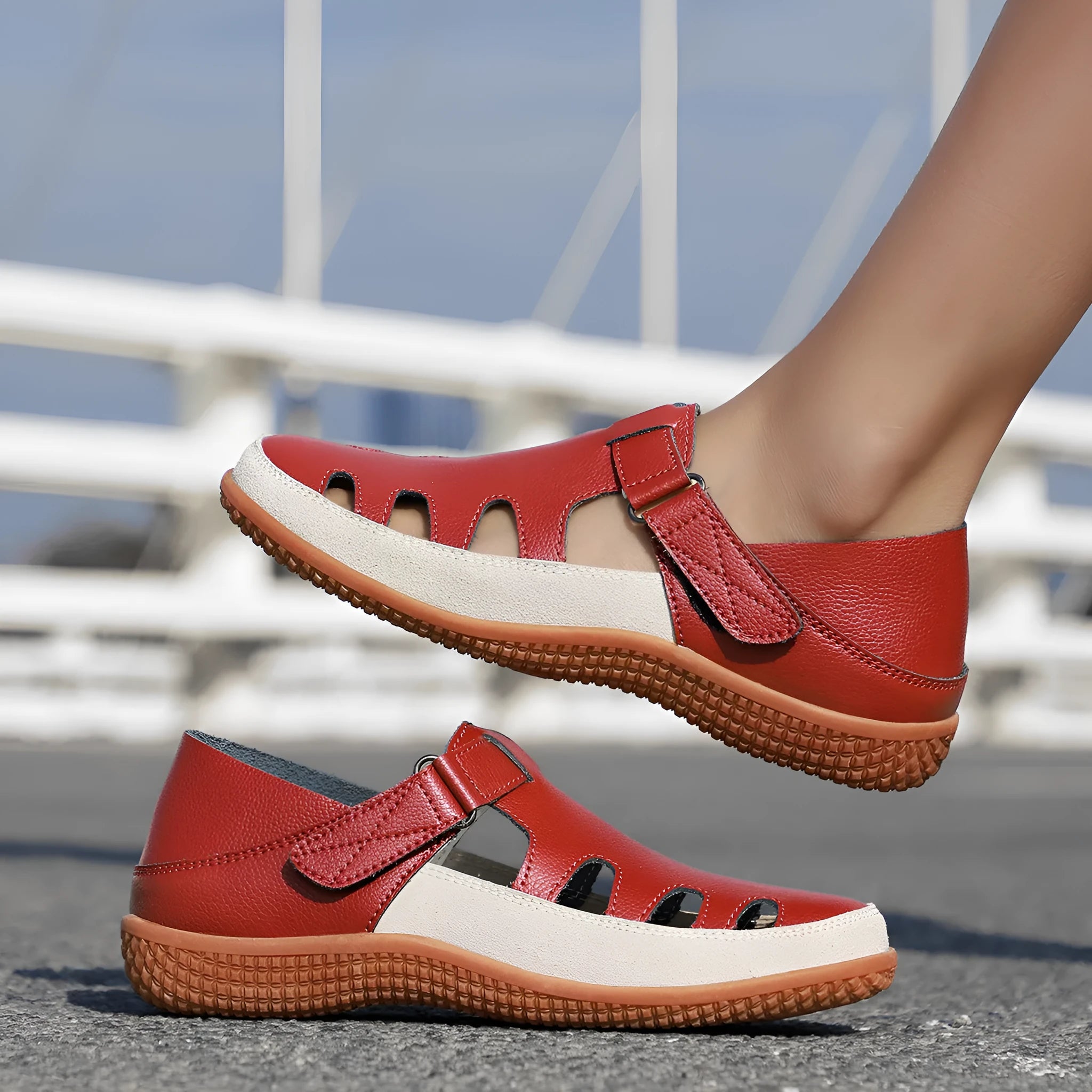 Women's flat sandals with hollow-out toe cap design in blue colour showing thick rubber sole