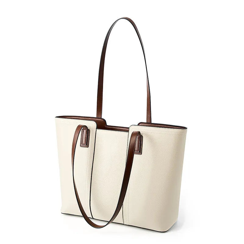Black genuine leather women's shoulder bag showing internal organiser pockets and crossbody strap