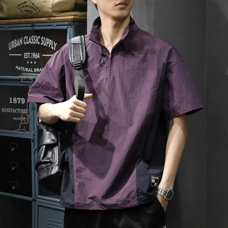 Brown men's loose-fit T-shirt with a half-zip stand collar and short sleeves.