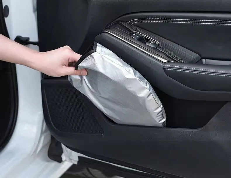 Universal fit aluminium foil car windscreen sunshade showing titanium silver reflective surface.