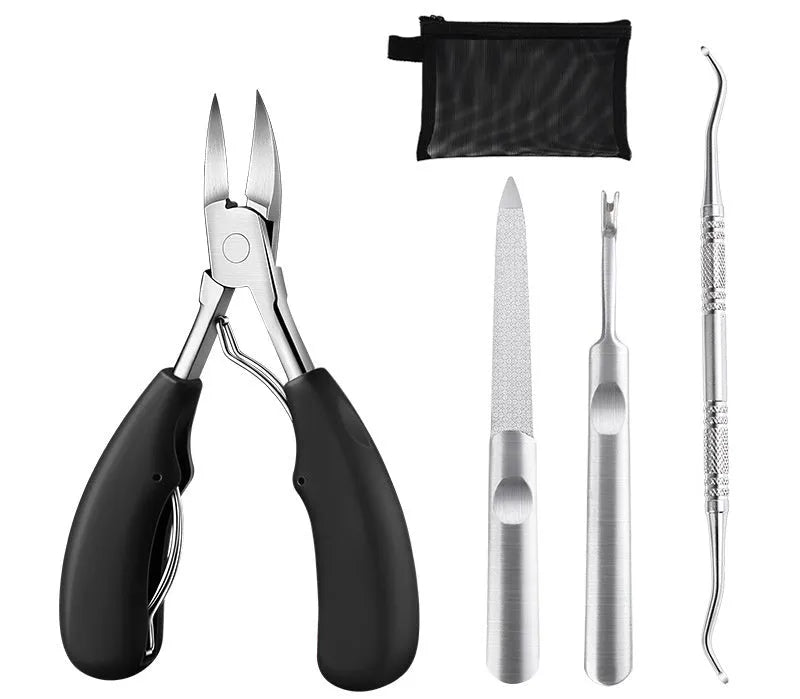 Stainless steel professional nail clipper and manicure tool set with olecranon scissors on a table