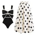 Women's black one-piece swimsuit with a white round skirt and a bow at the centre front