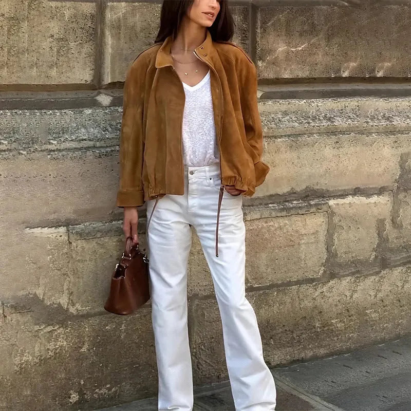Retro-style loose-fit solid colour jacket with long sleeves on a hanger.
