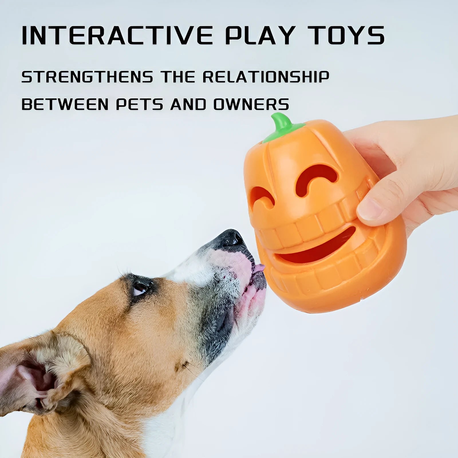 Orange Halloween pumpkin shaped rubber dog toy with a hollow centre for treats.