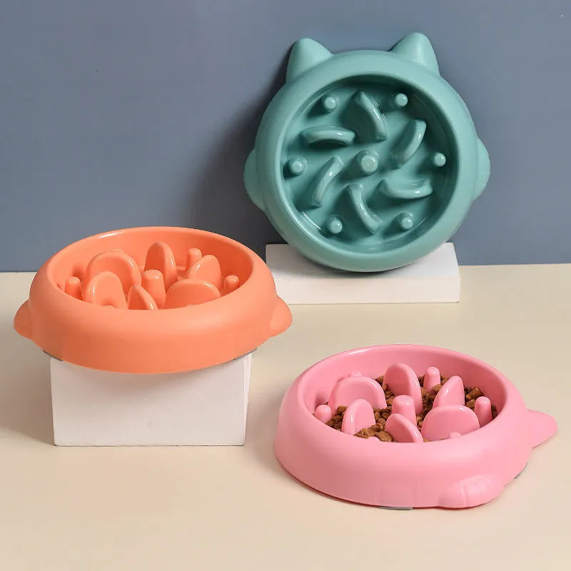Green bone-shaped slow feeder bowl for dogs with raised interior ridges