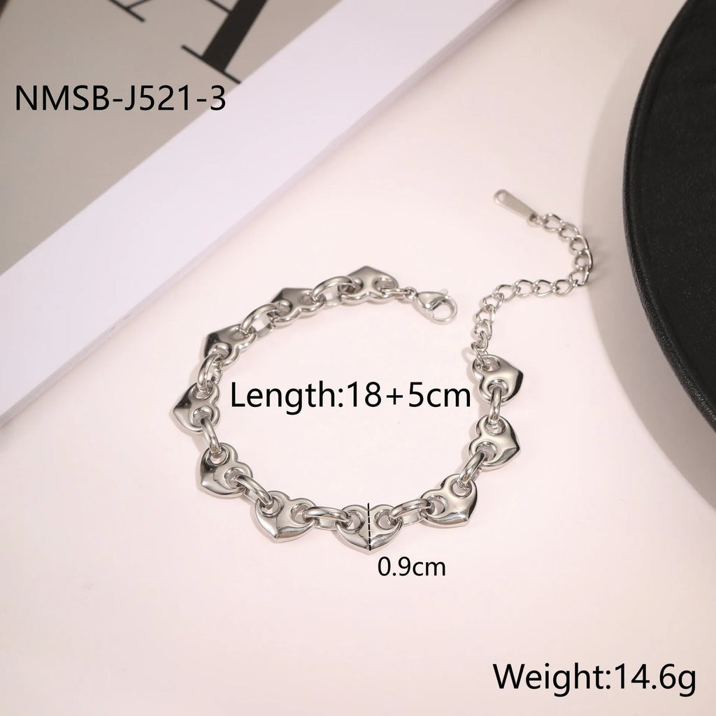 Hollowed-out heart women's bracelet in stainless steel with 18K electroplated finish showing geometric design