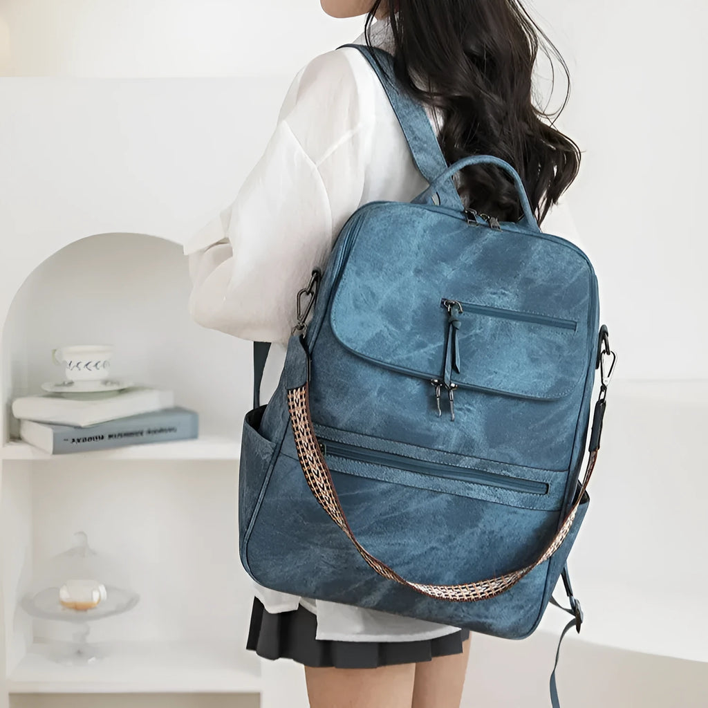Retro college backpack with curved shoulder straps in six colour options including black, blue, and yellow apricot