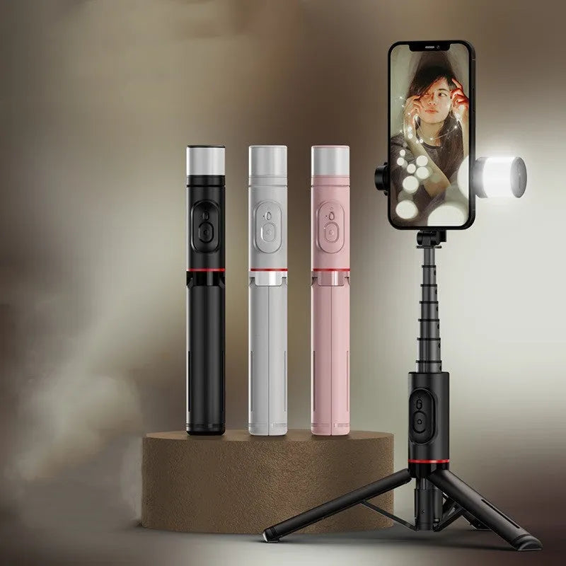 Aluminium alloy Bluetooth selfie stick with fill light extended to 765mm showing remote control and LED light head