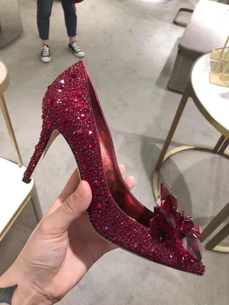 Women's gold pointed toe stiletto heels with sequin cloth upper and rhinestone decoration
