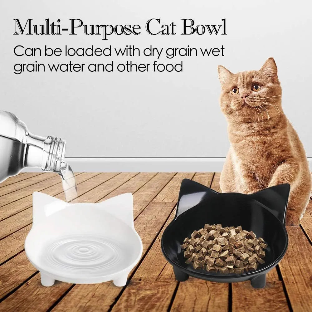 Shallow black or white melamine cat bowl with a non-slip rubber base on a table.