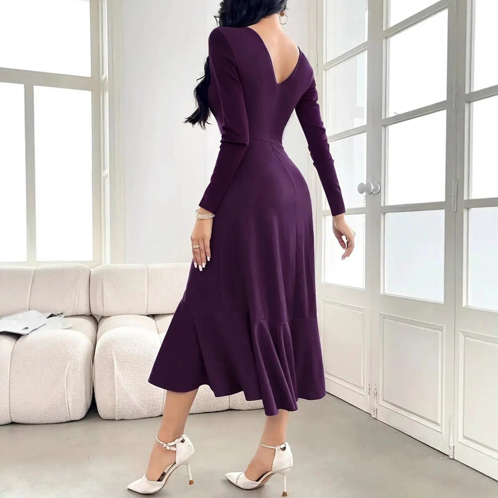 Purple women's dress with ruffle detailing, long sleeves, and round neck in mid waist design