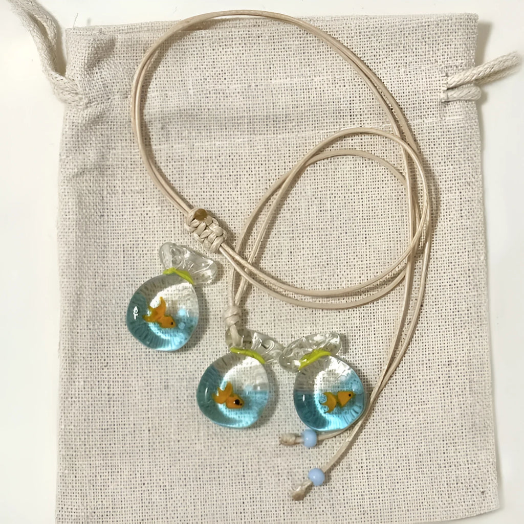 Women's pendant necklace with coloured glaze skirt joker character on a cotton linen clavicle chain.