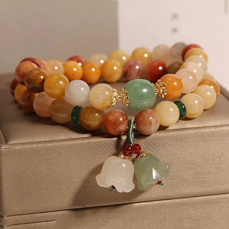 Natural jade multi-layer bracelet for women with a white orchid pendant charm on an elasticated cord