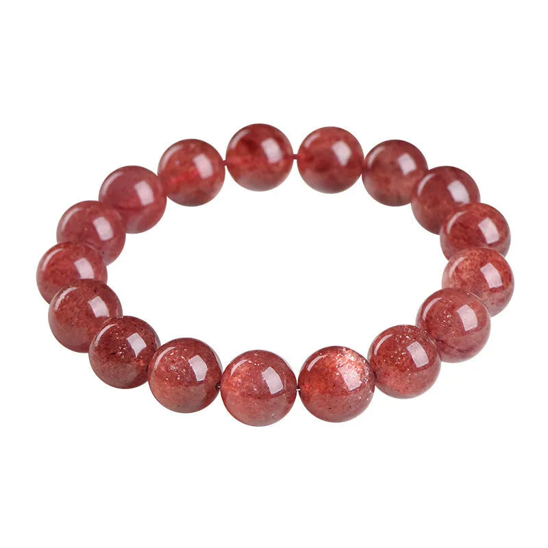 Natural cherry red strawberry quartz bracelet with geometric cut stones on wrist