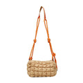 Soft nylon women's crossbody messenger bag in pillow shape with a rhombus pattern and a zippered inner pocket.