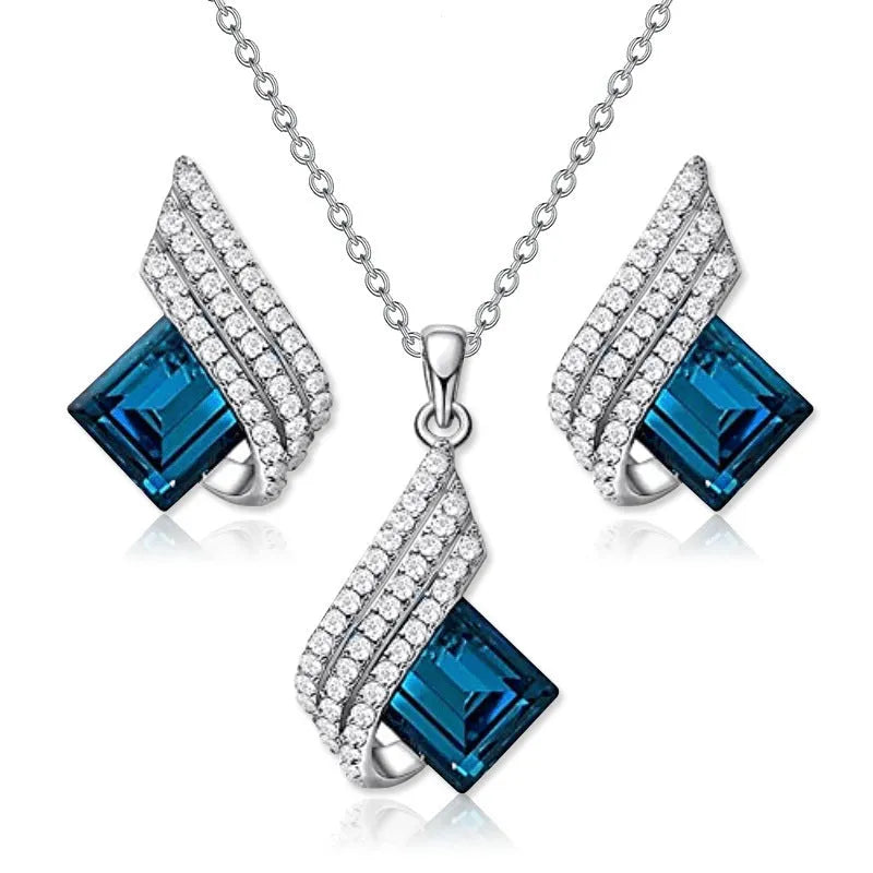 Necklace and earrings jewellery set with alloy pendant and glass details on cross chain