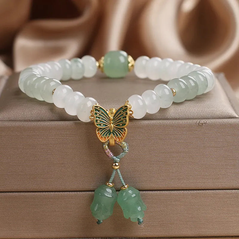 Green Tian Shan Cui abacus bead bracelet with retro butterfly tassel and pearl accents