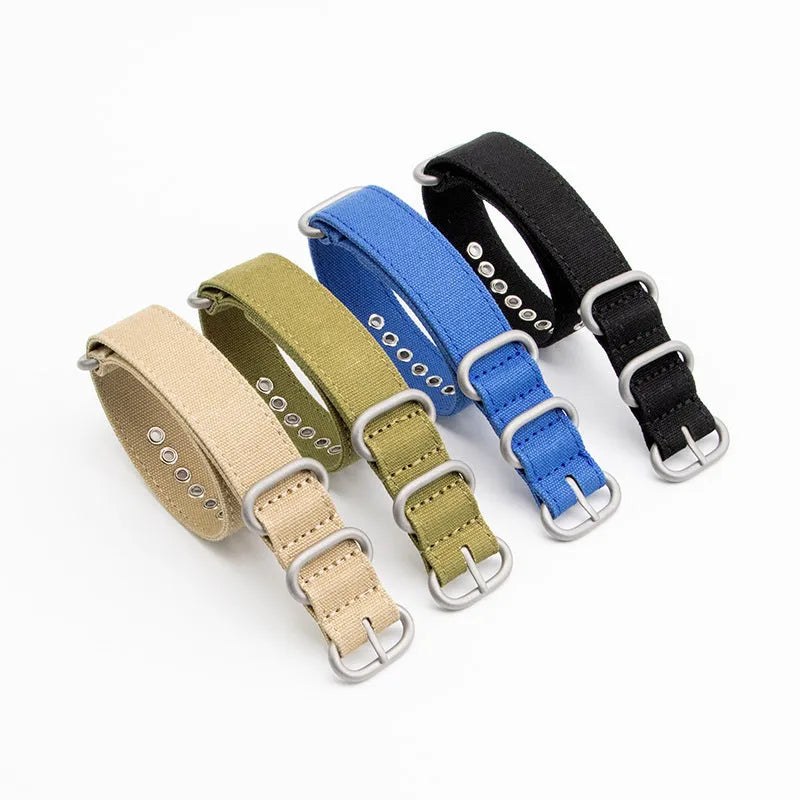 Canvas nylon thickened watch band with silver buckle in army green colour on a white background showing weave texture