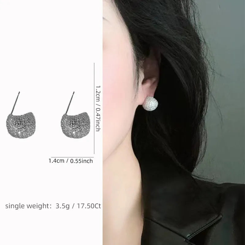 Geometric drop earrings with diamond accents and golden beans in gold and white colours