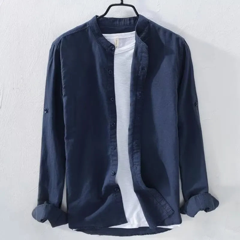 Loose fit long sleeve linen shirt in solid colour on hanger showing casual collar and button front
