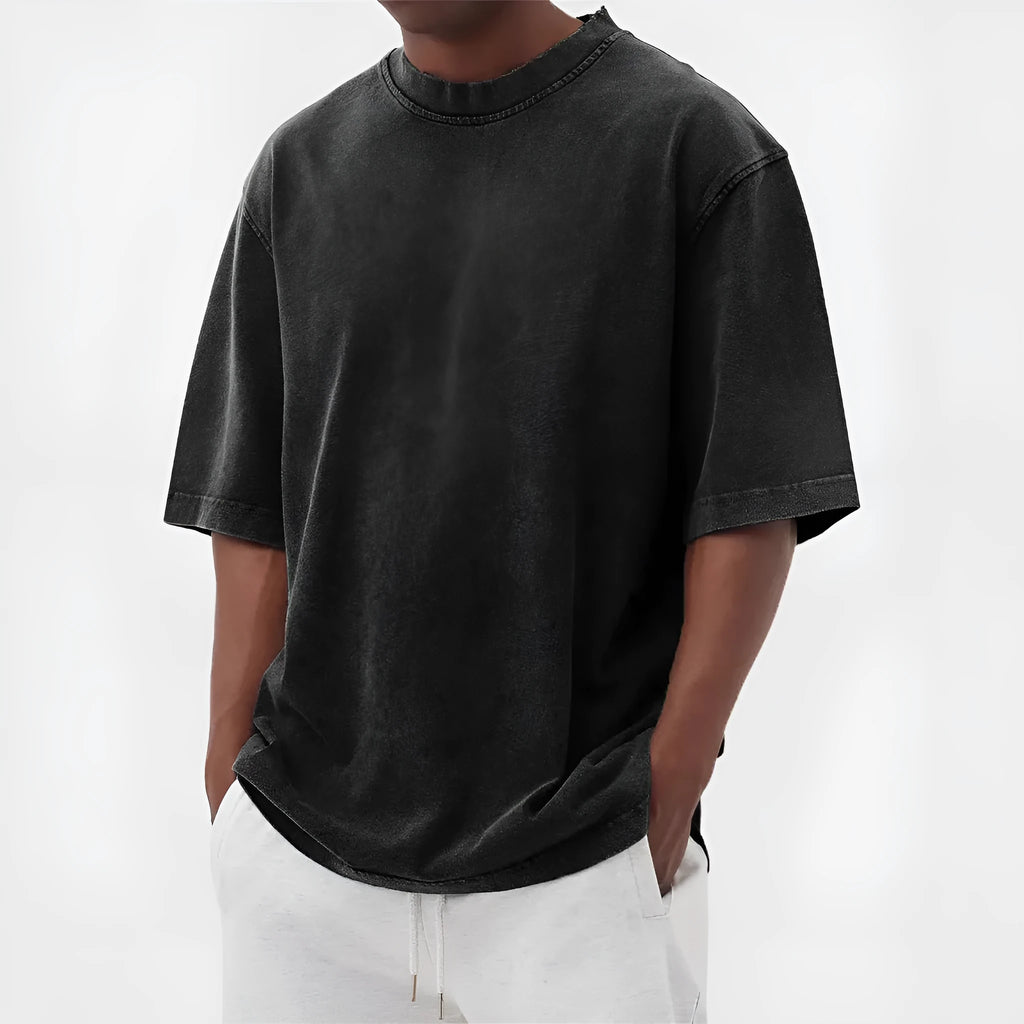 Men's loose fit stone washed polyester t-shirt in army green colour, showing distressed texture and short sleeves.