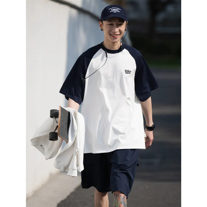 Men's blue Japanese junior style raglan sleeve t-shirt with loose fit on hanger