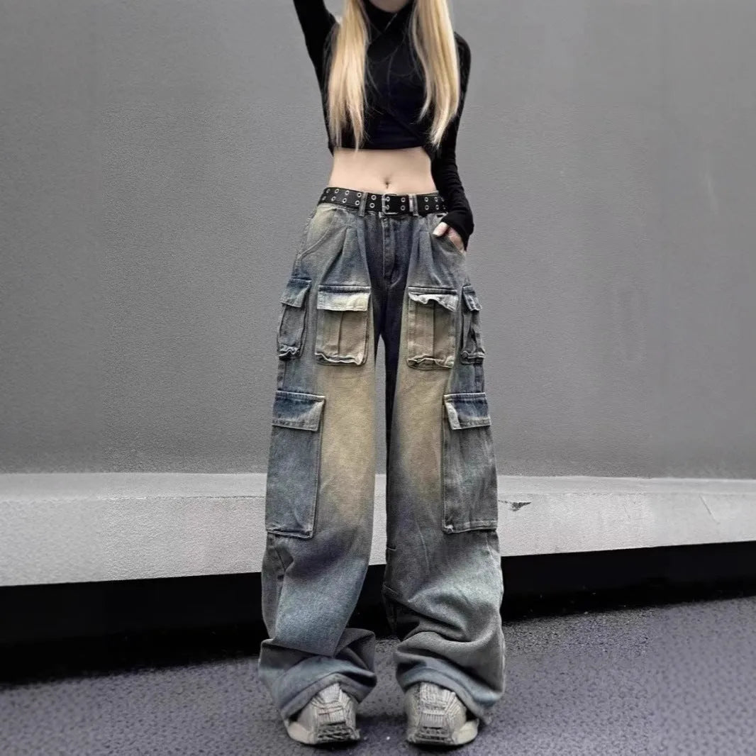 Light blue and black loose fit distressed denim pants with multiple tooling-style pockets