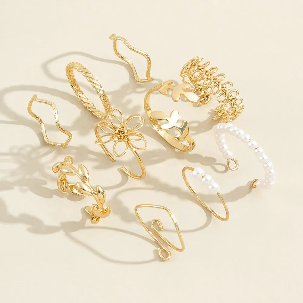 Gold openwork floral pattern alloy ring with electroplated glossy finish