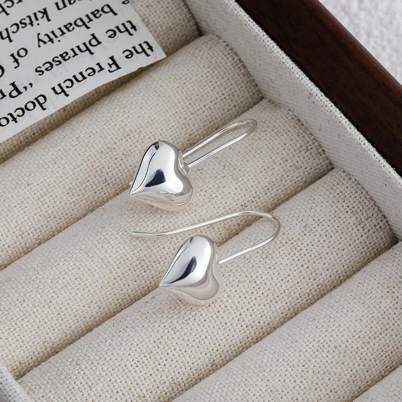 Korean-style copper heart earrings with 3D glossy finish and silver heart-shaped ear hooks