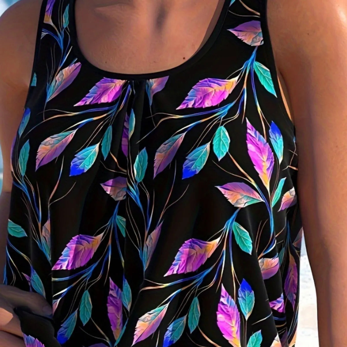 Women's solid colour one-piece swimsuit with a leaf pattern design, showing the top and matching shorts.