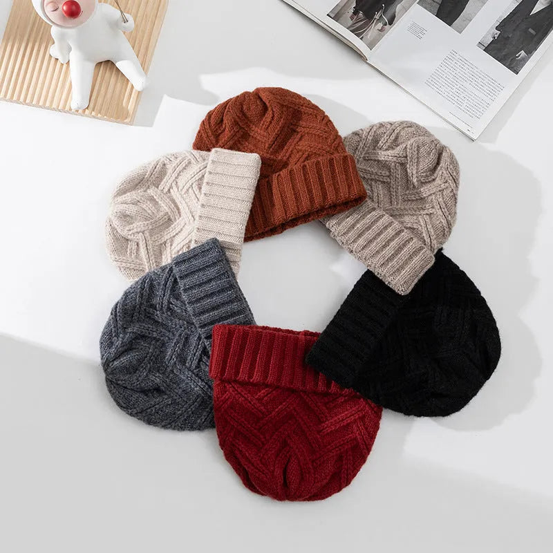 Women's wool knitted dome crown winter hat shown in multiple colour options including ivory white, khaki, and obsidian black.