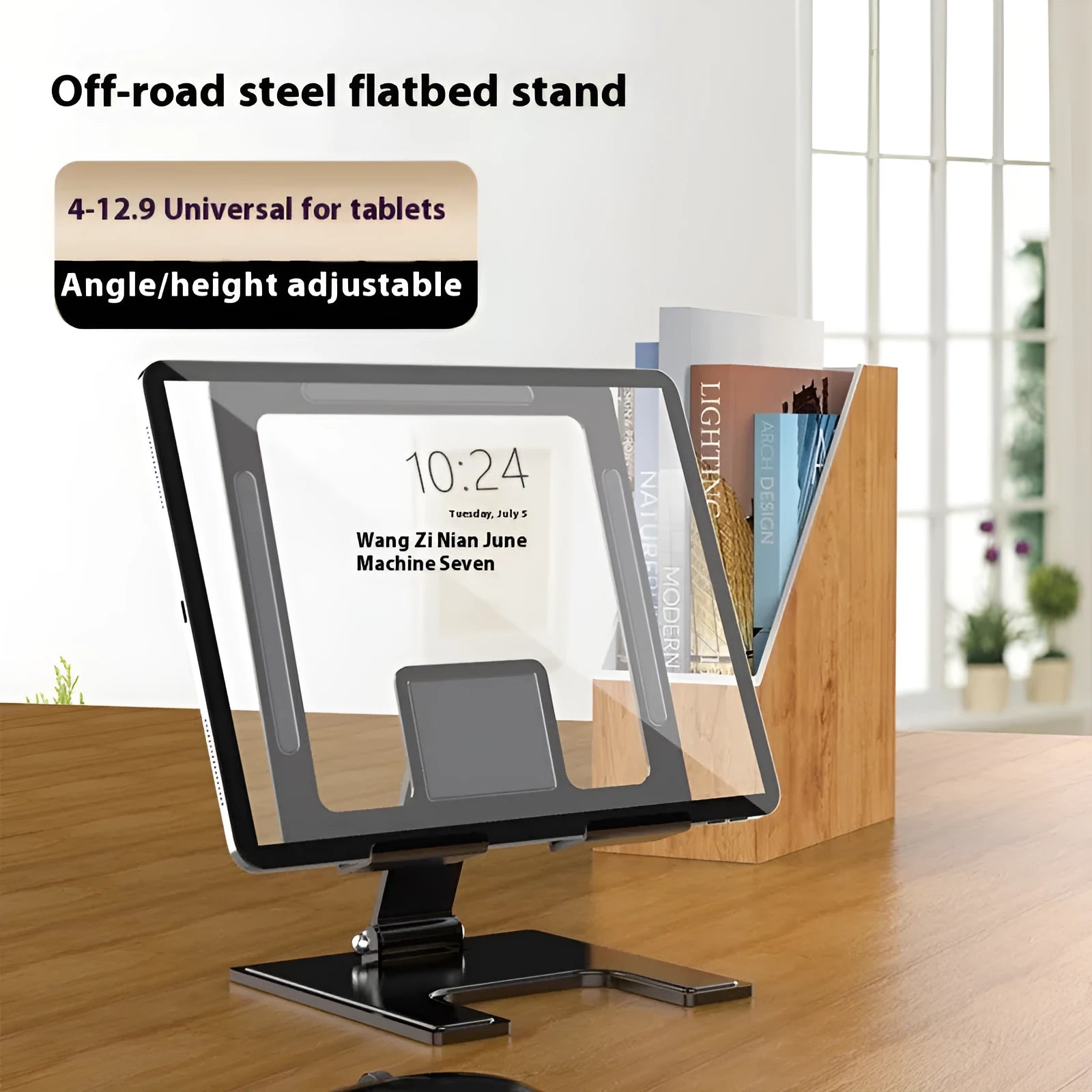 Flat black metal foldable notebook bracket with rotating base on a wooden desk