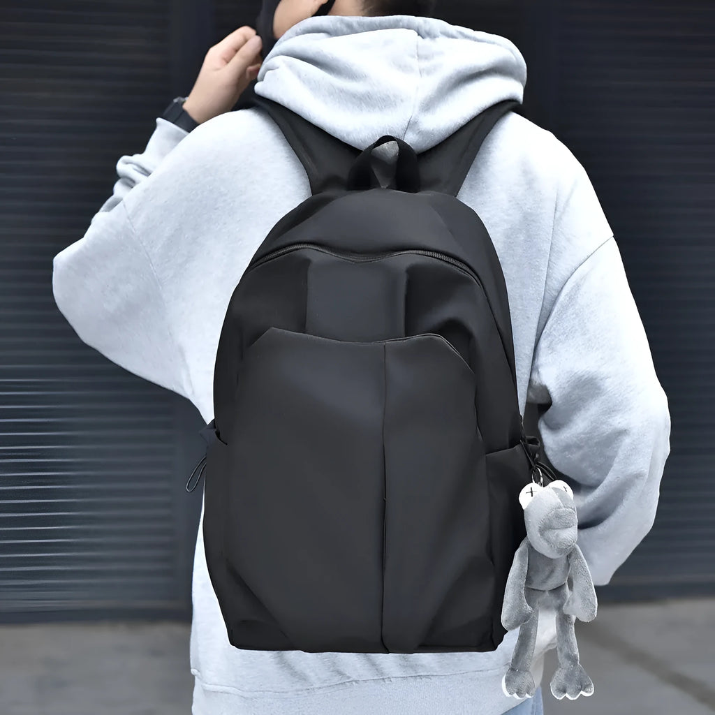 Casual large capacity backpack Oxford cloth 20-35L in black with curved shoulder strap and sewing line detail