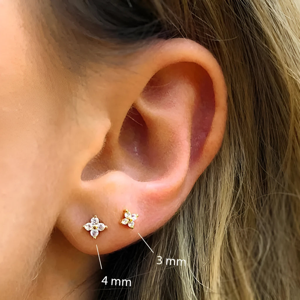 Geometric petal crystal flowers stud earrings in sterling silver with gold or platinum finish.