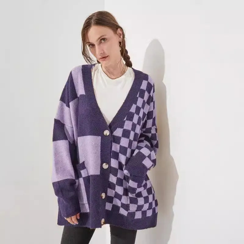 Grey loose fit knitted cardigan with a printed checks pattern, showing regular sleeves and a slim silhouette.