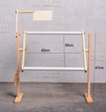Adjustable vertical pine wood cross stitch frame on desktop