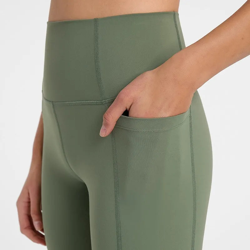 Women's black sport shorts with super stretch fabric and mid-thigh length.