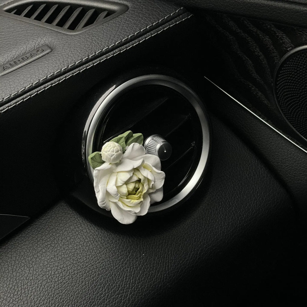 Jasmine scent solid gypsum car air vent perfume clip in beige white or fresh green.