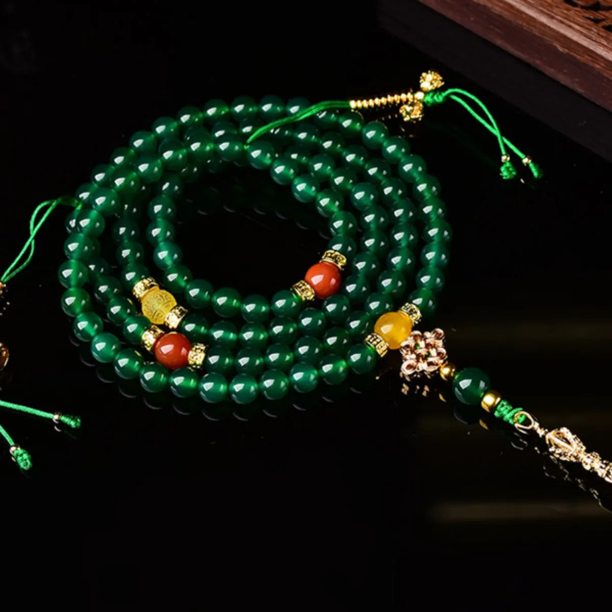 Brazilian green agate multi-strand bracelet showing different bead sizes on a wrist.