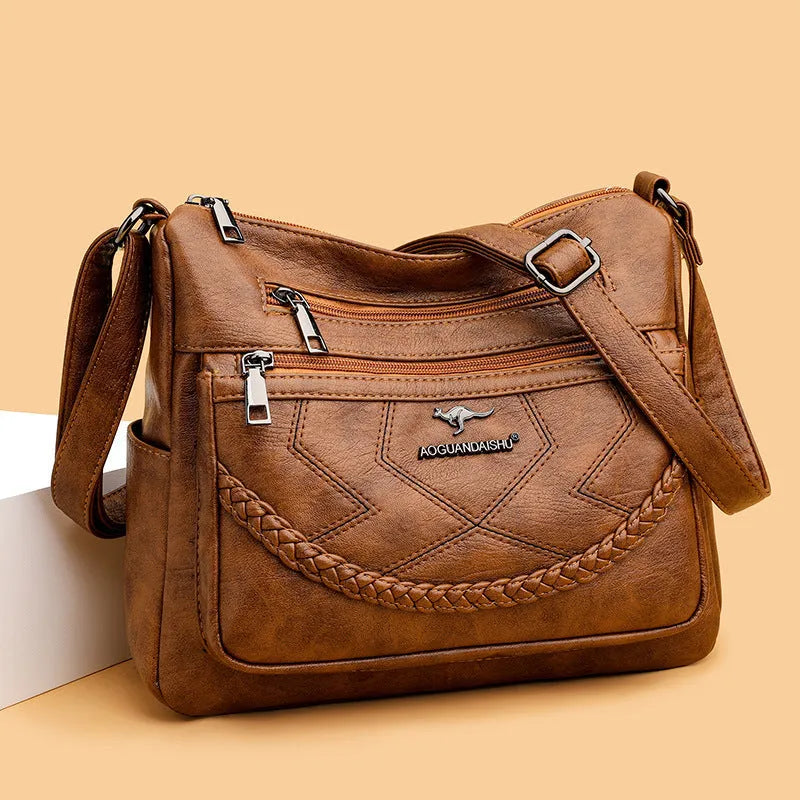 Soft PU leather women's shoulder bag with crossbody strap in black colour
